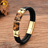 alt="Bracelet homme en cuir tressé noir avec pierres œil de tigre doré et fermoir doré"

