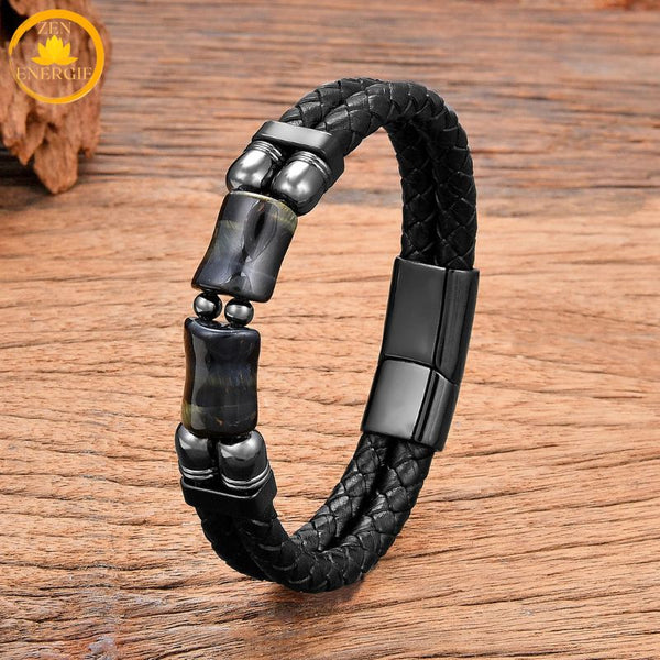 alt="Bracelet homme en cuir tressé noir avec pierre naturelle œil de faucon bleu-gris"
