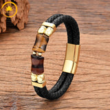 alt="Bracelet homme en cuir tressé noir avec pierres œil de tigre doré et œil de taureau rouge, fermoir doré"
