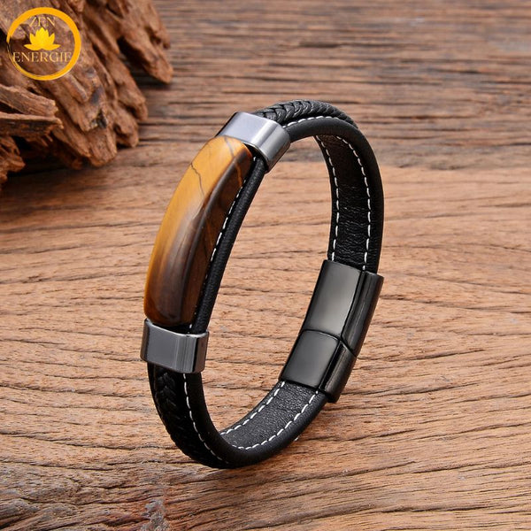 alt="Bracelet en cuir noir avec pierre naturelle œil de tigre et fermoir métallique noir"
